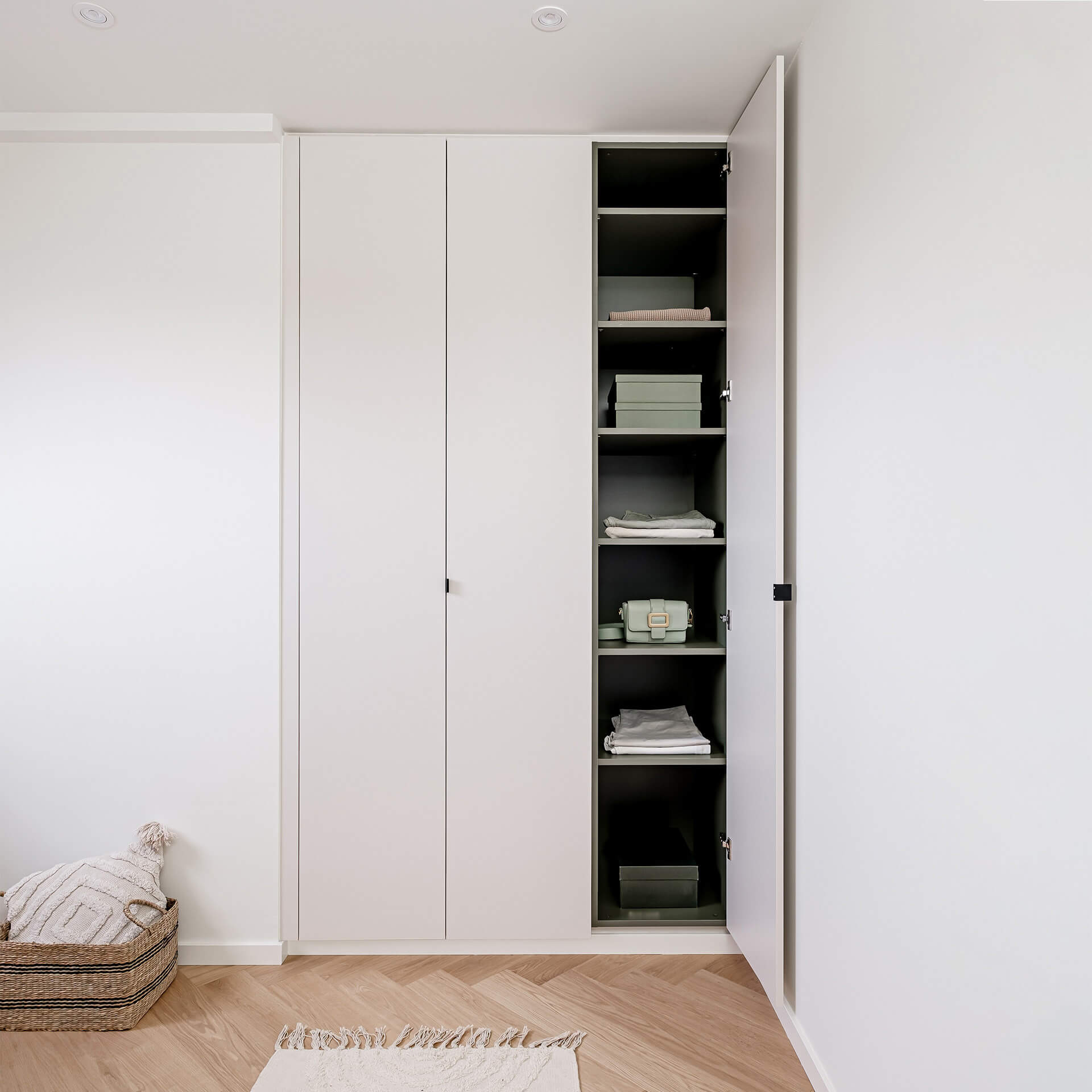 Made-to-measure storage cabinet in Seashell outer colour and Green Shadow inner colour