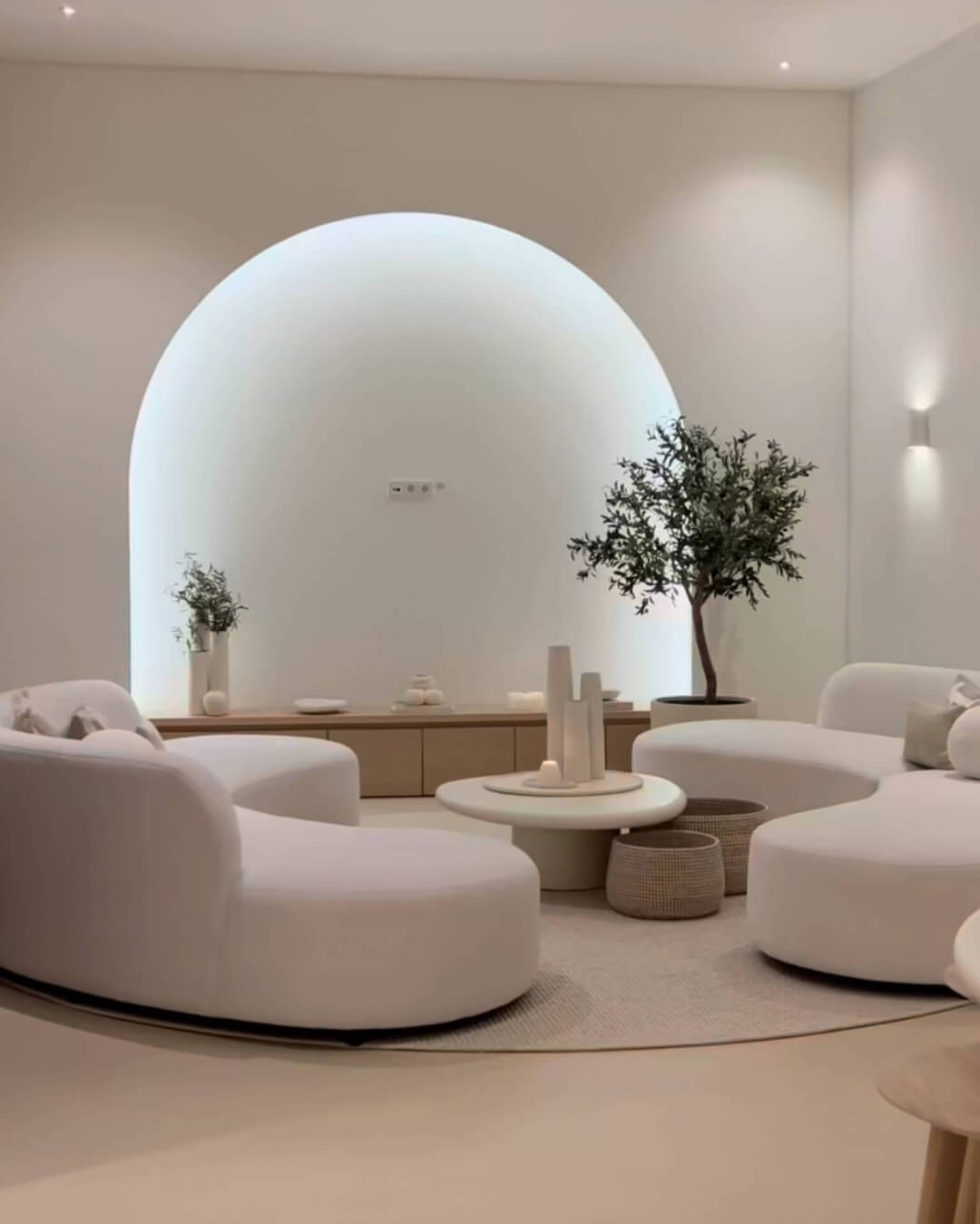 TV corner with cinewall in an arch with custom-made TV cabinet in natural wood shade
