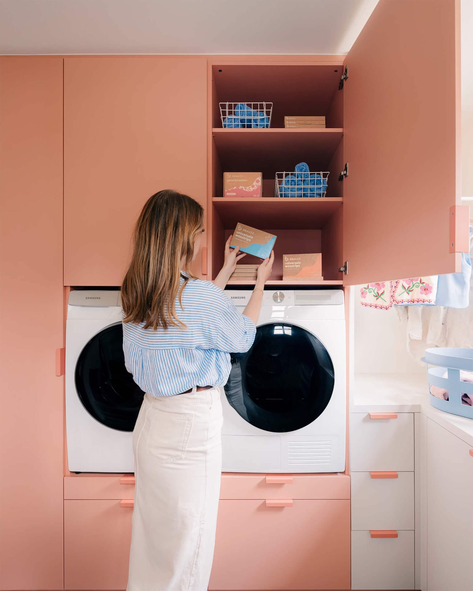 Laundry room with bespoke closet for washing machine and tumble dryer