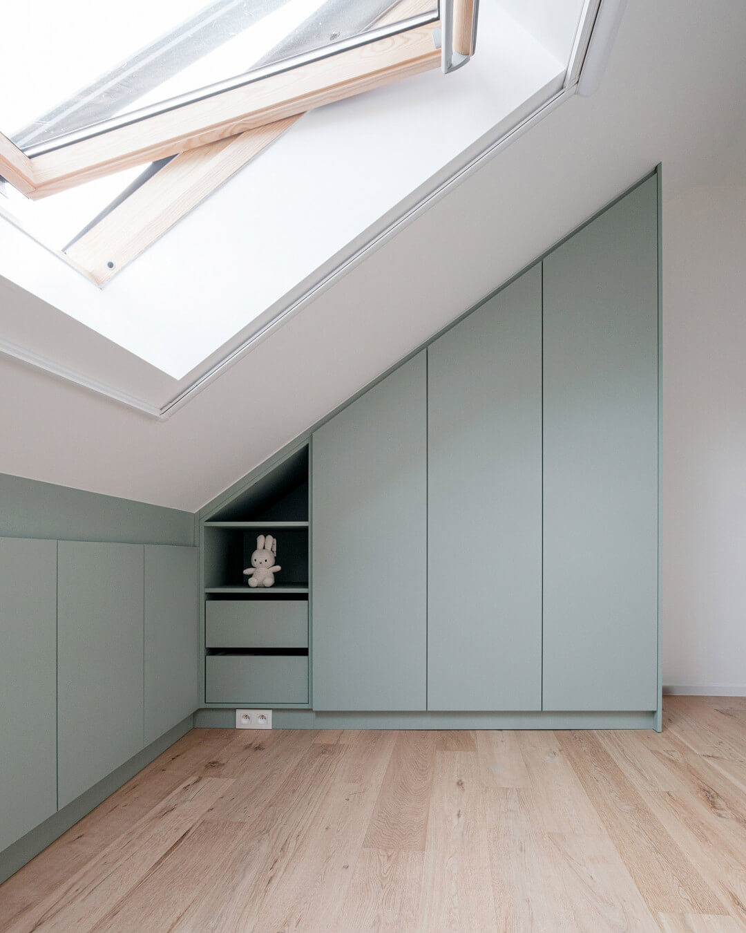 bespoke cupboards under a sloping roof