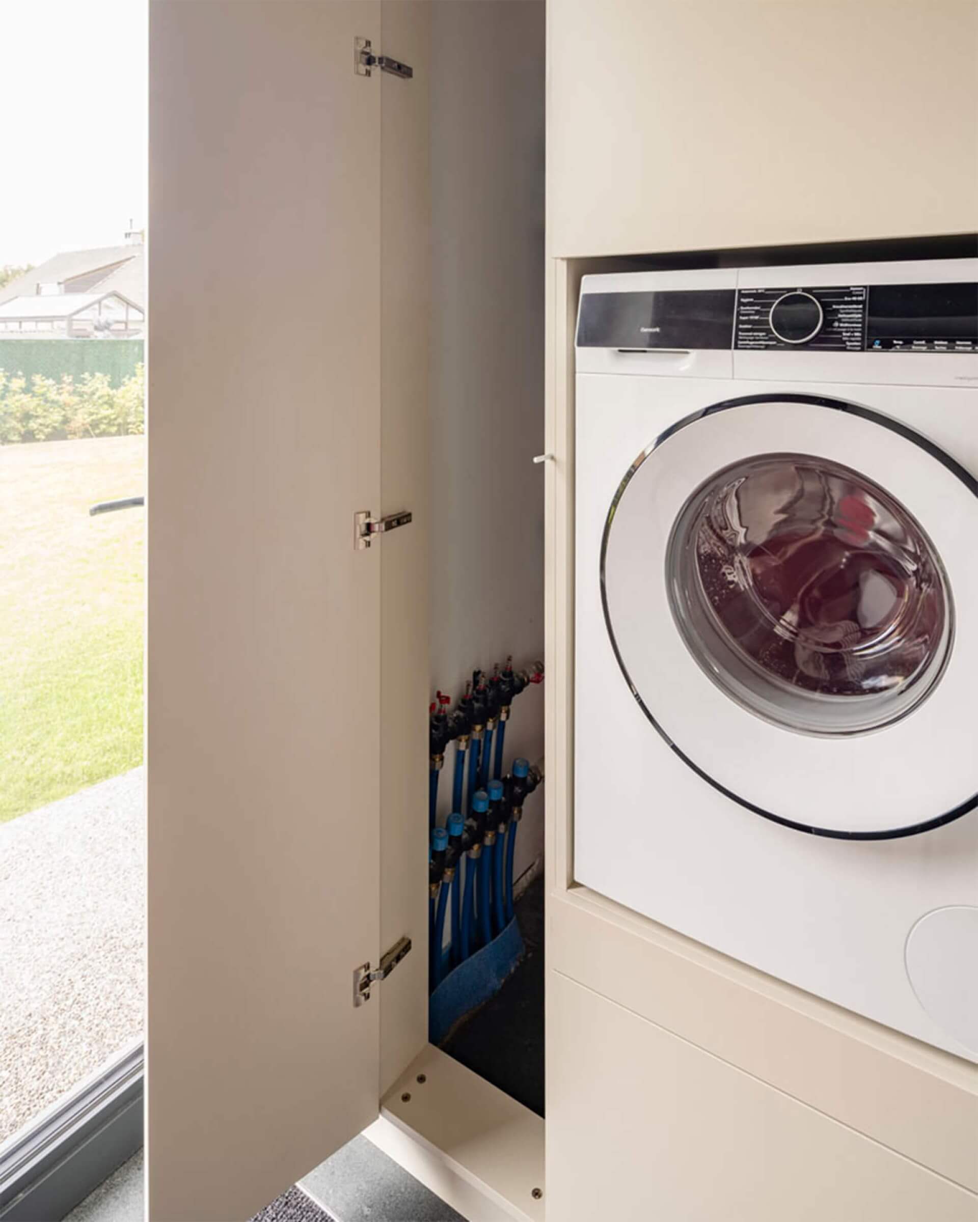 collectors concealed in a technology cabinet combined with a washing machine cabinet 
