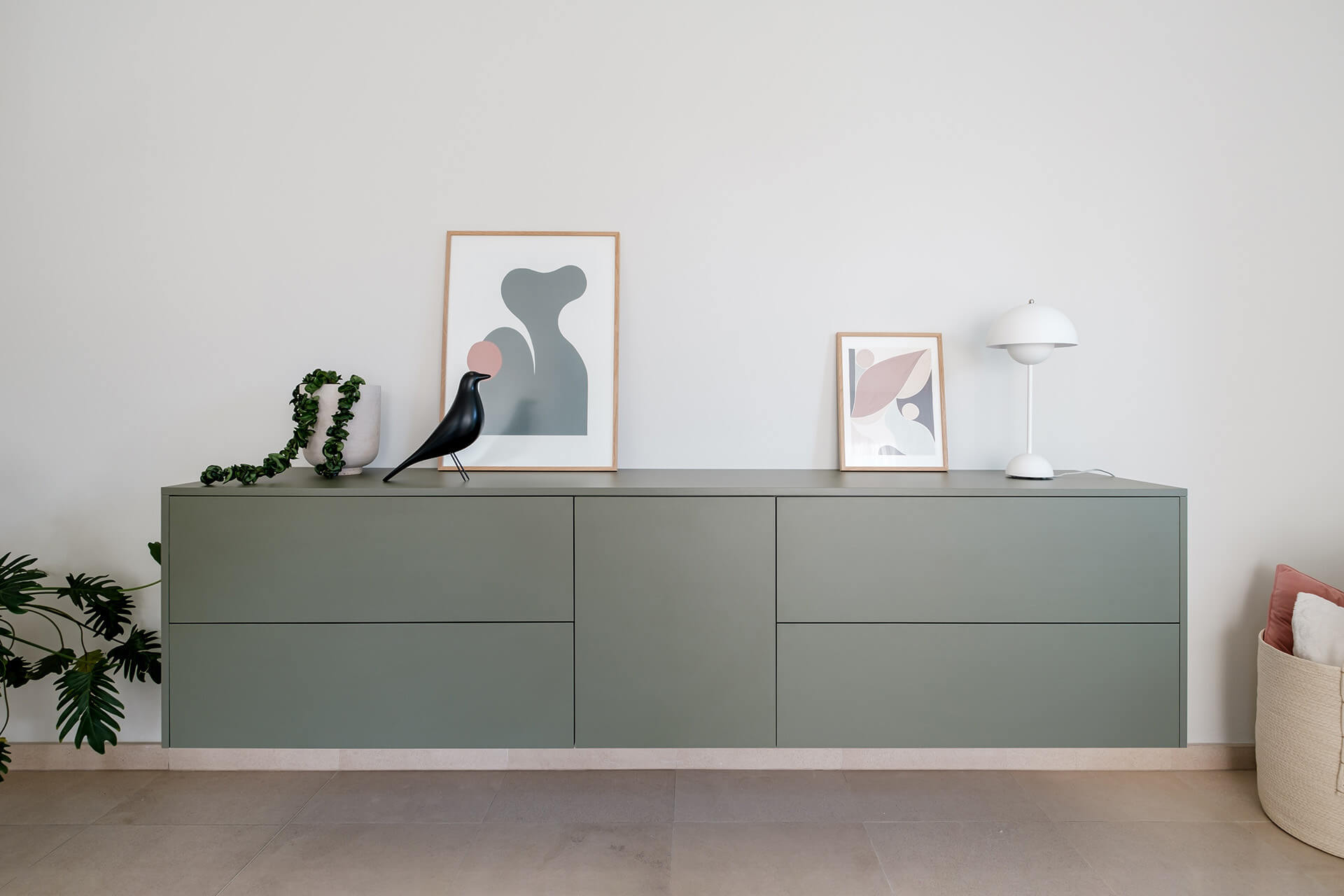 Floating chest of drawers in green shadow