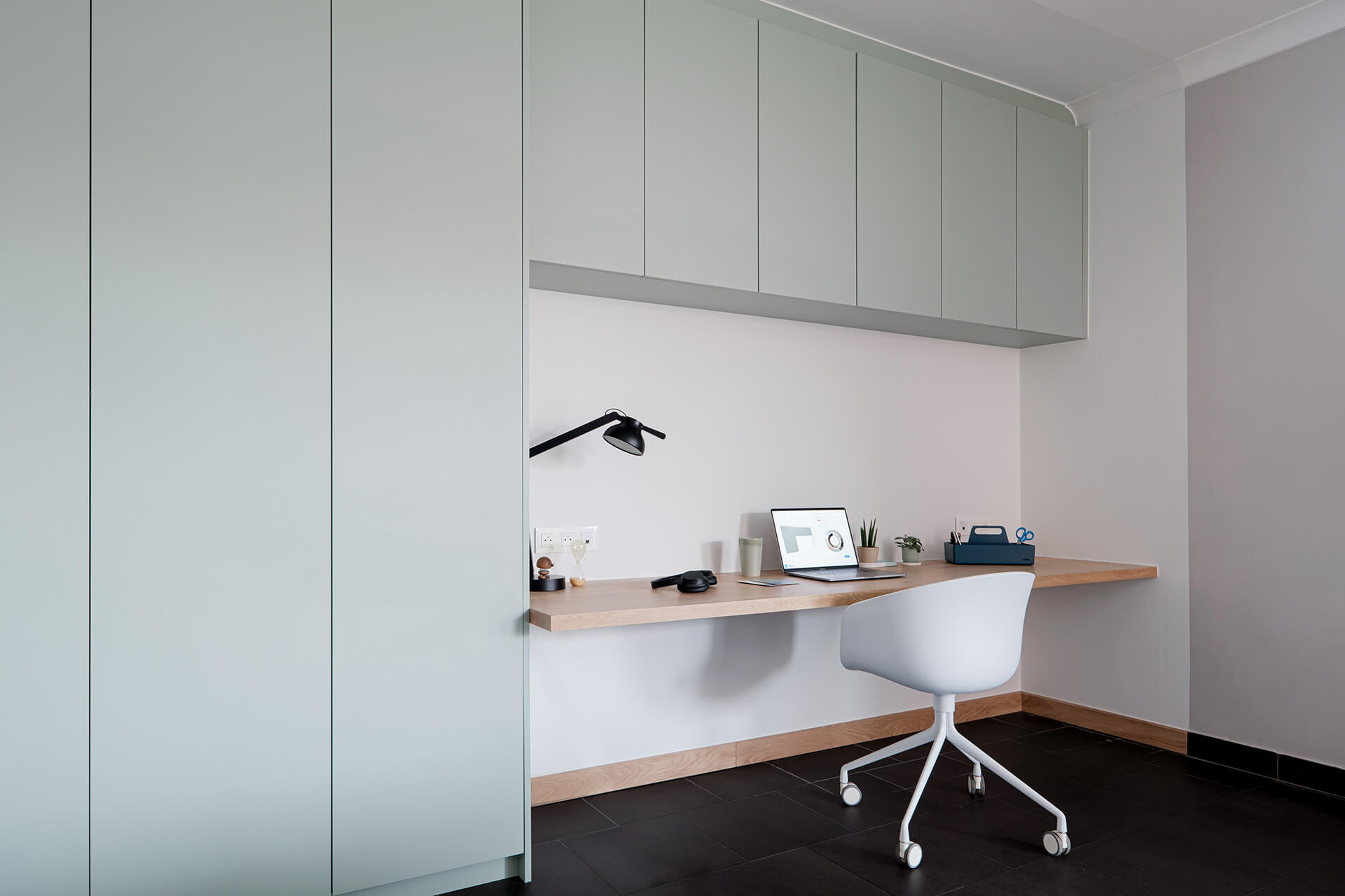 Custom office cabinets for the home workspace in the color Industrial Green.