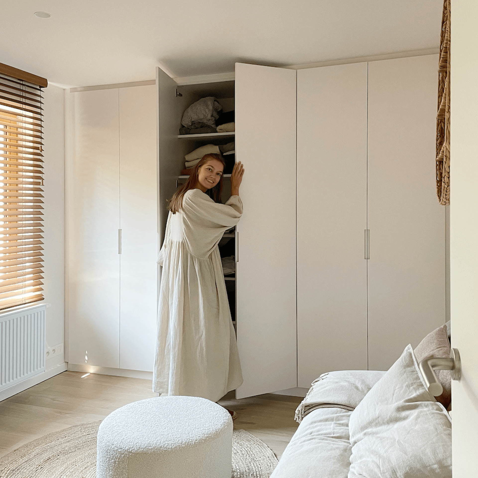 Influencer Romy Vanhaecke in her dressing room with her bespoke mdf wardrobe with short recessed handles