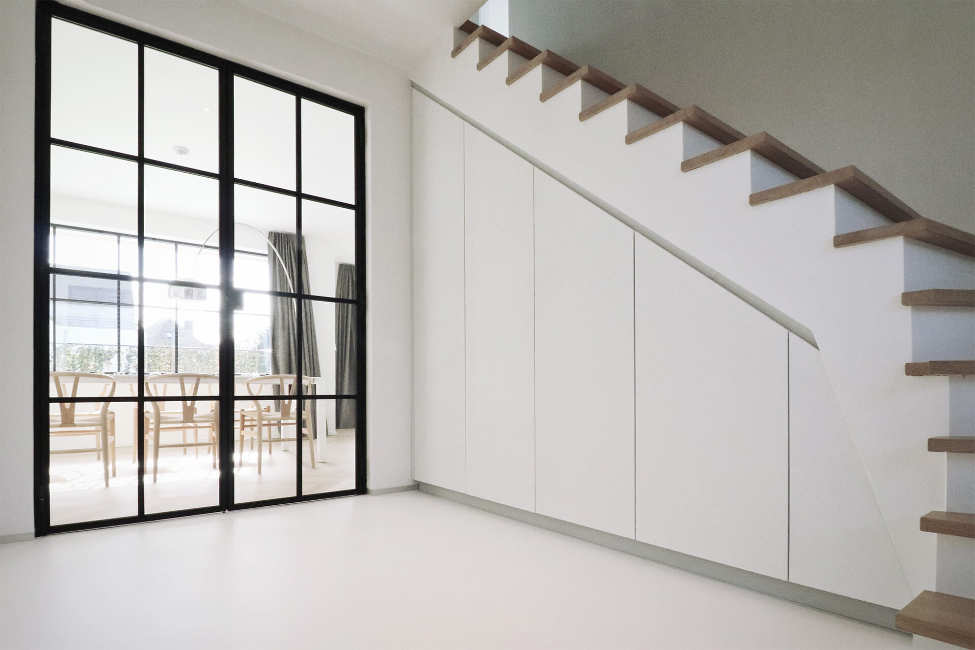 White custom-made stair cupboard
