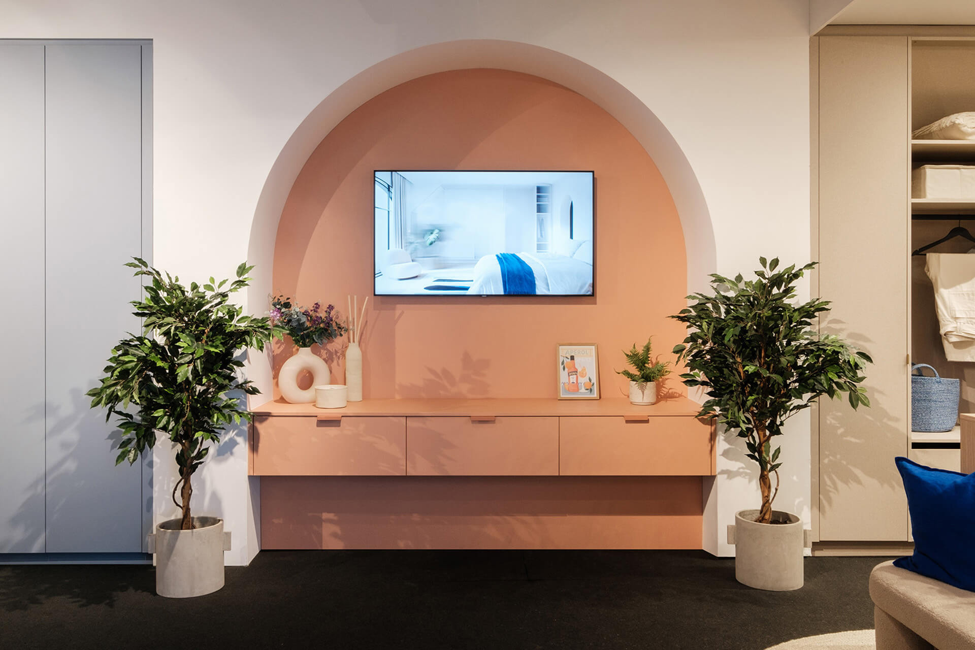 Made-to-measure suspended TV unit in a pink colour, presented at the BIS exhibition stand
