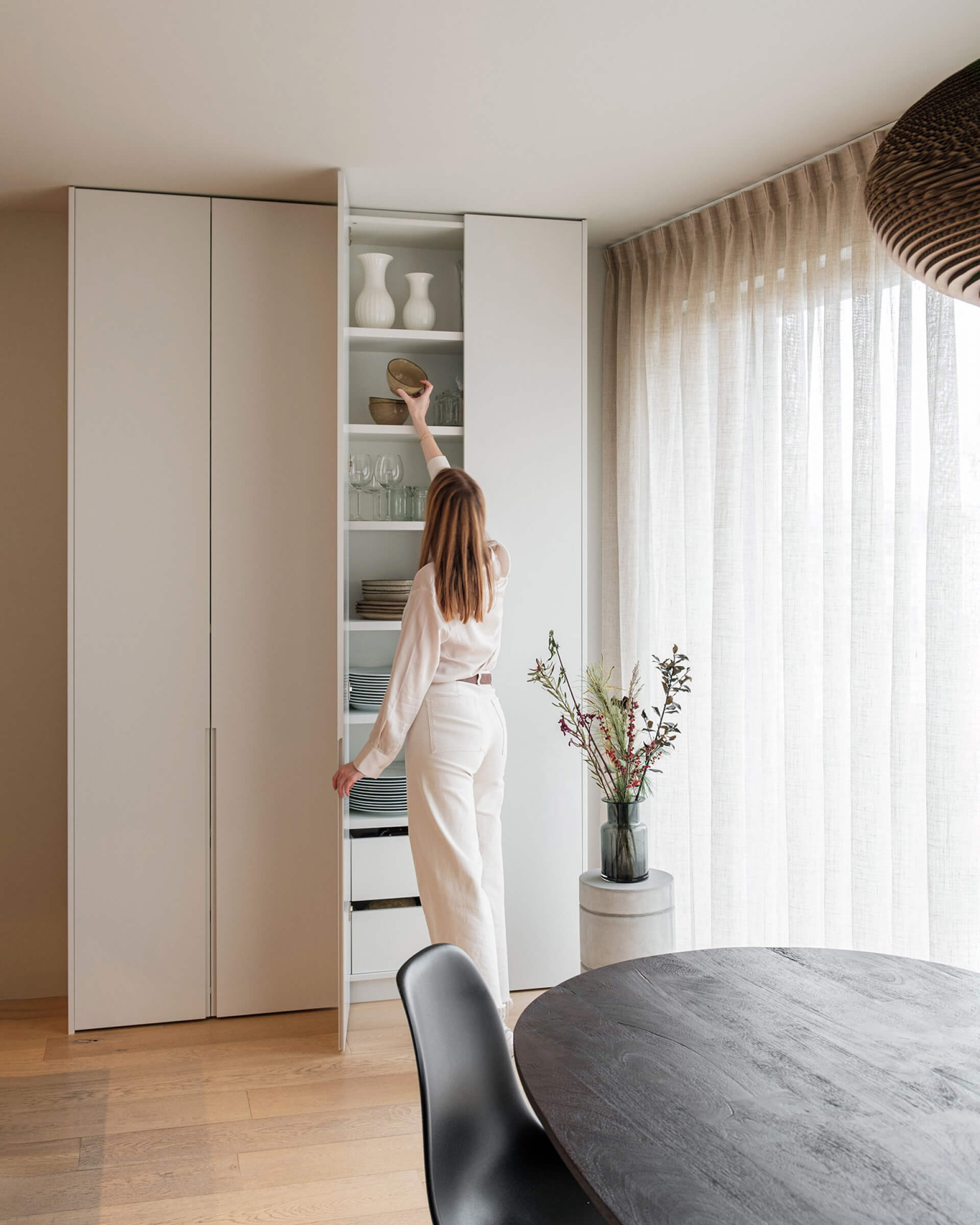 Free-standing cupboard in mdf with long recessed handles 