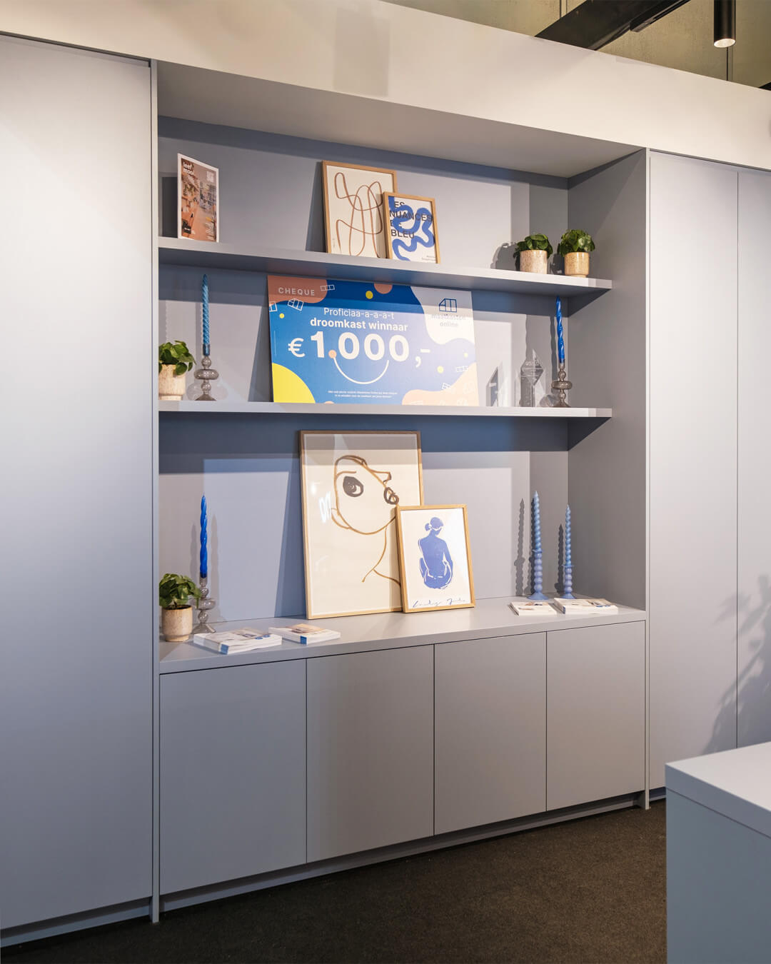 Bespoke wall unit in the colour Silver Blue, shown at the BIS 2023 exhibition stand