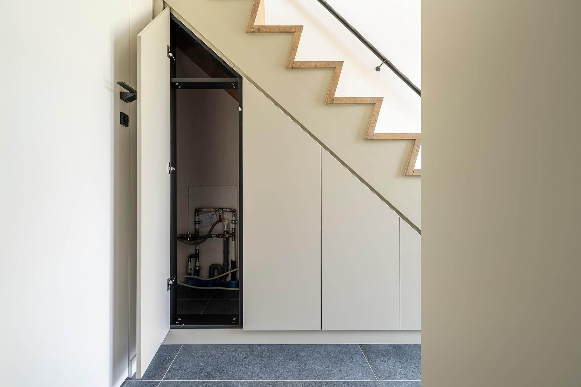 Custom staircase cupboard in the color Turtle Grey