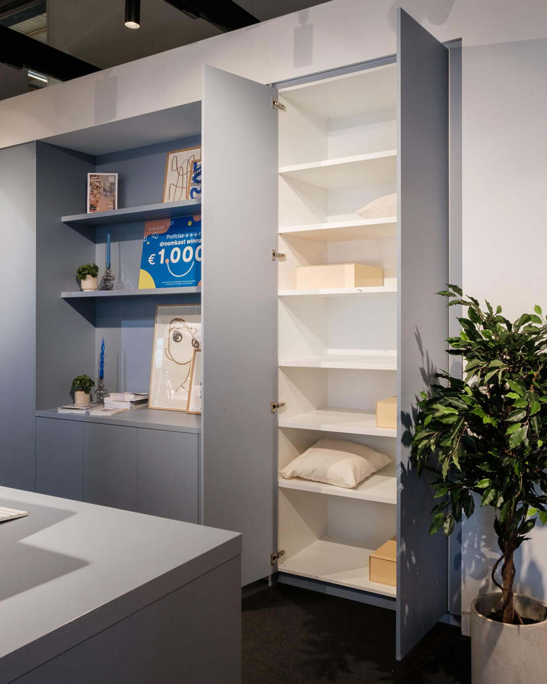 Wall combination cabinets in the colour Silver Blue, exhibited at the BIS 2023 exhibition stand