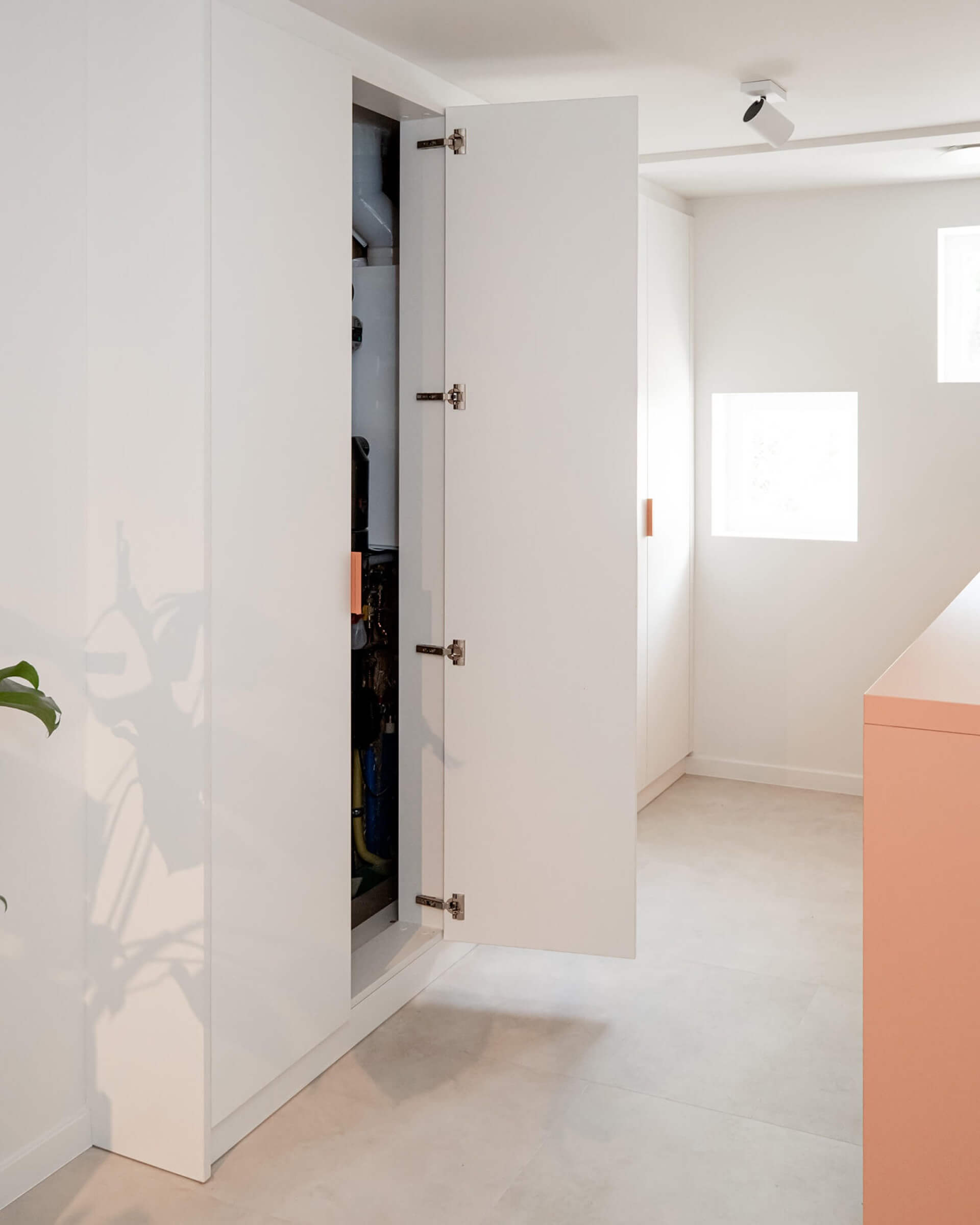 bespoke white techniques cabinet in laundry room