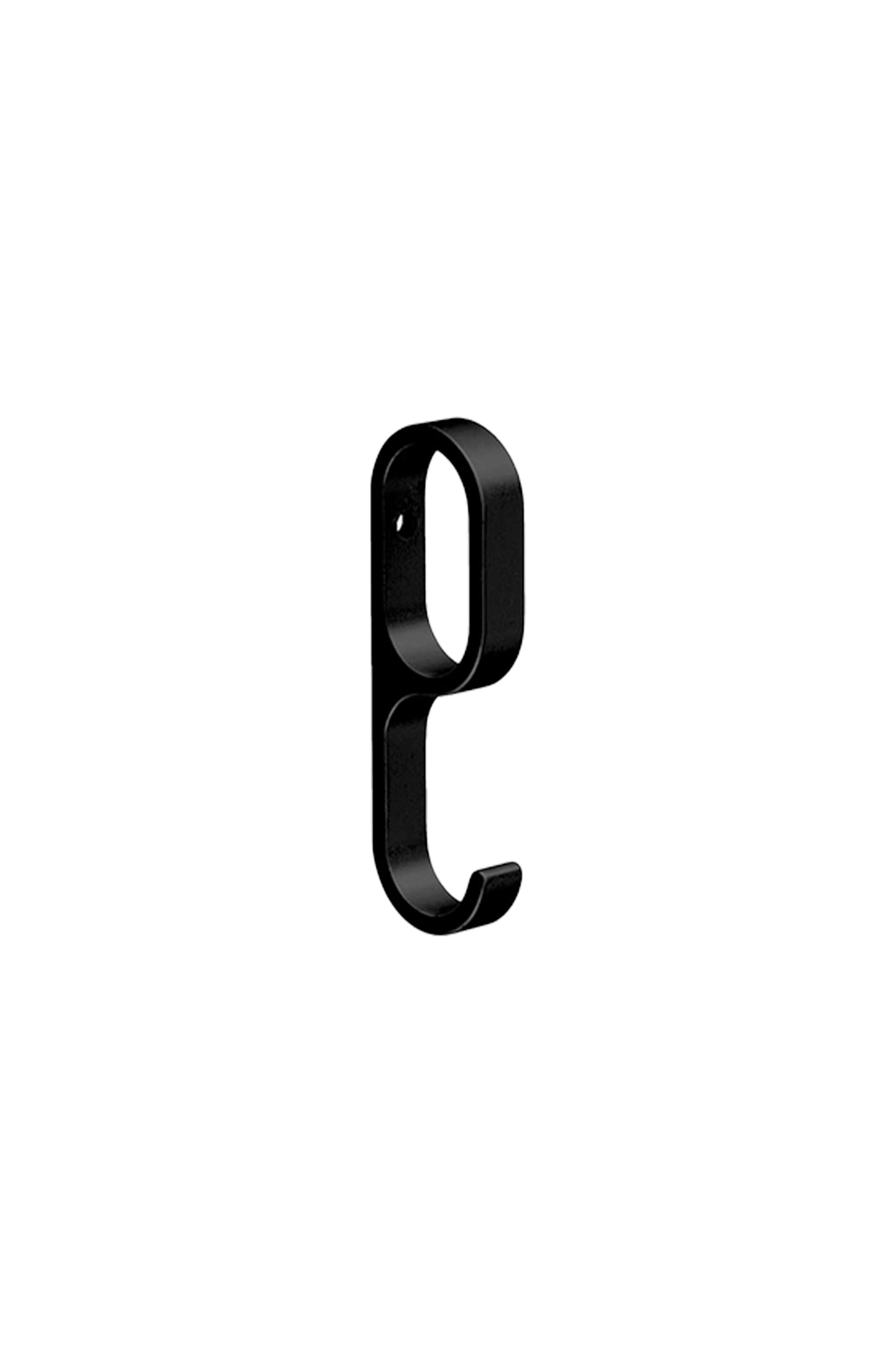 Close-up of a black clothes hanger on a rail in a custom wardrobe. The stylish, matte finish creates a modern look in any dressing room or closet.