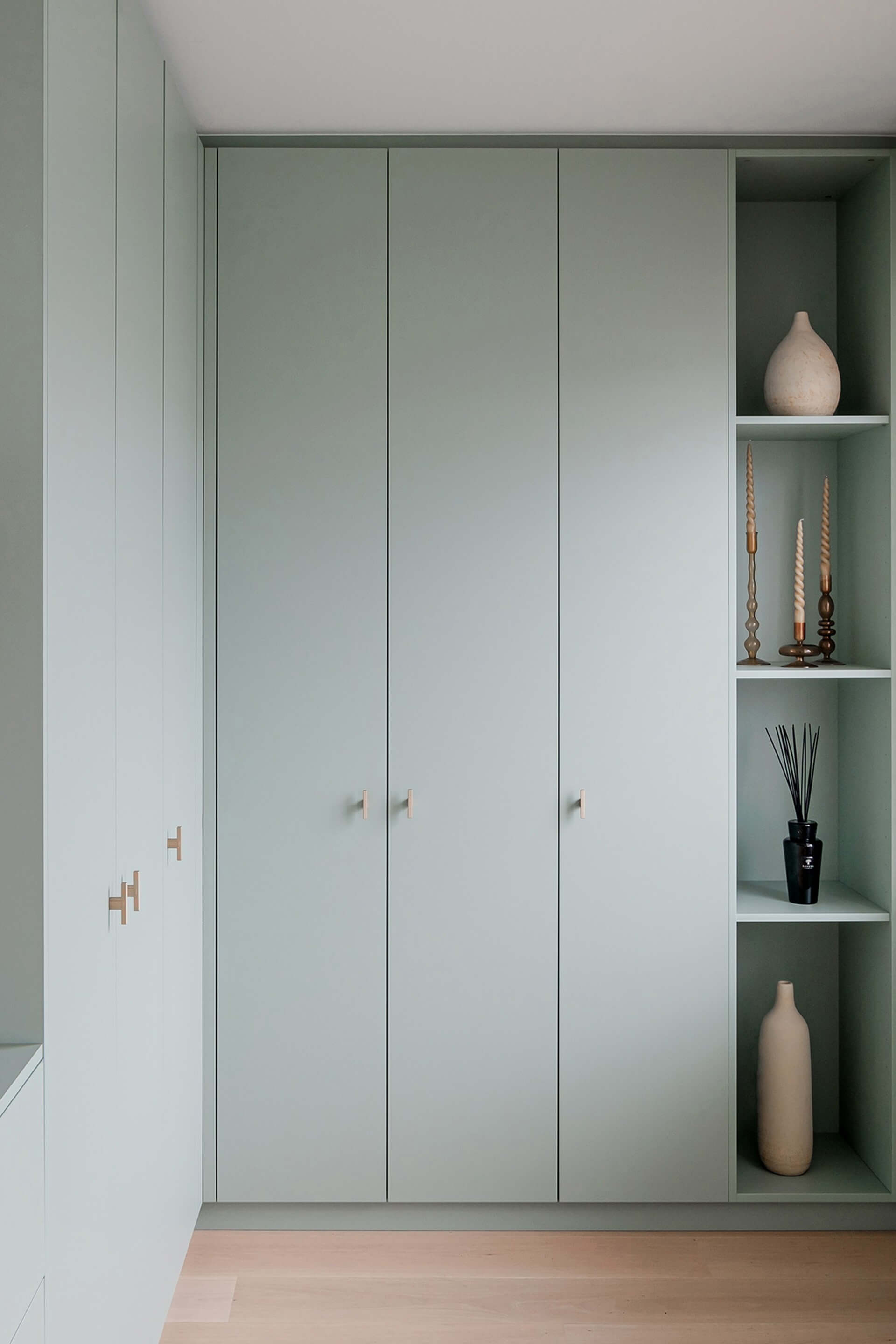 Custom corner cabinet in Industrial Green with T-Diamond brass handles